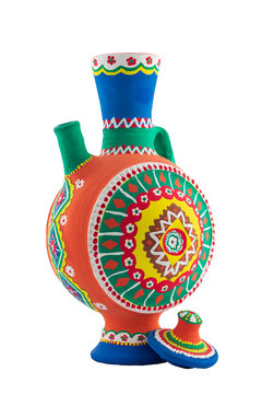 Nubian style handmade artistic painted colorful decorated pottery jug with one handle isolated on white including clipping path