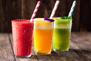 Three smoothies in glasses served on the table
