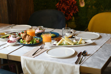 Delicious food served on various plates on a table