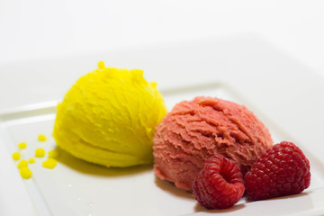 Set of ice cream scoops of different colors and flavours with fruits decoration isolated on white background 