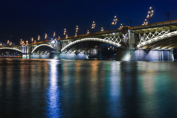 Night view of Budapest. Panorama cityscape of famous tourist destination with Danube and bridges. Travel illuminated landscape in Hungary, Europe.