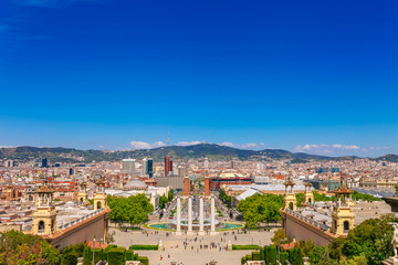 Fototapeta premium Skyline landscape of beautiful Barcelona from the Montjuic in a clear blue sky and sunny day. Famous tourist destination Catalonia, Spain