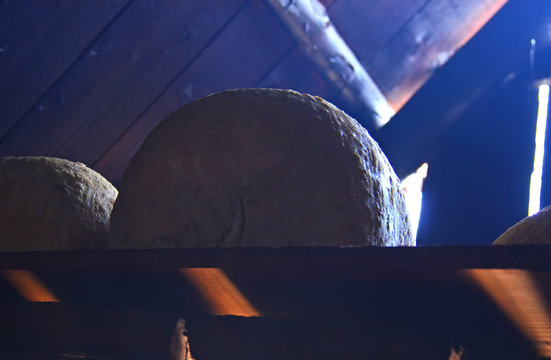 Freshly made handmade goat cheese stands on a wooden shelf in the sun