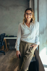 Positive businesswoman in office