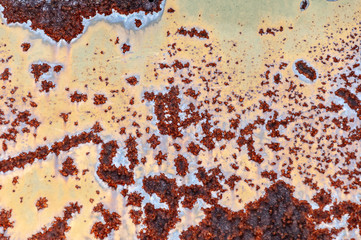 Metal wall with rusty places