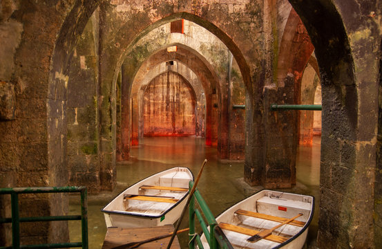 Rowboat at the underground Pool of Arches in Ramla. Israel. Pool built during the reign of the caliph Haroun al-Rashid in 789 AD