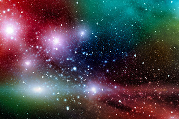 Multicolored cosmic nebulae in the sky with stars. Bright cosmic abstract background.