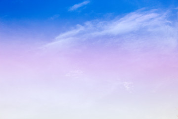 A soft fog cloud background with a pastel colored orange to blue gradient