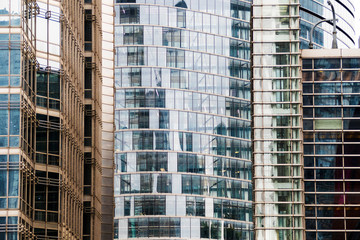 details of the facade of a modern skyscraper made of glass and steel closeup. Shanghai World Financial Center