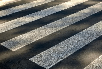 pedestrian crossing white stripes on asphalt