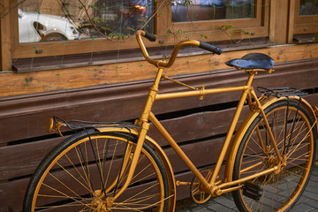 Fototapeta na wymiar old vintage retro gold painted bike