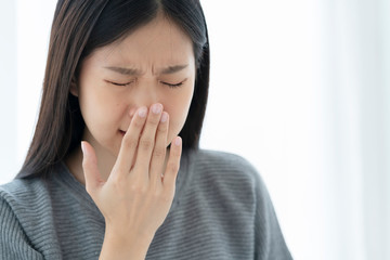 asian unhealthy woman feel cool with flu and cough all the time