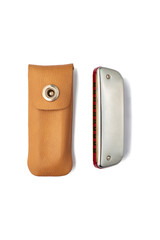 Harmonica and leather sheath on white background