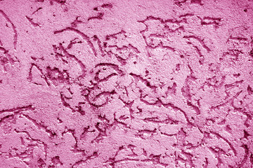 Old wall texture as background in pink color.