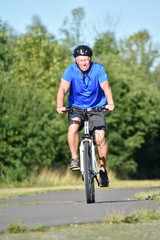 Athlete Male Cyclist Smiling Wearing Helmet Cycling