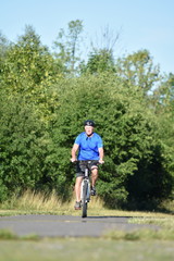 Adult Male Athlete And Exercise Wearing Helmet Riding Bike