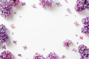 Poster Im Rahmen Decorative frame of beautiful purple lilac flowers. © Melica