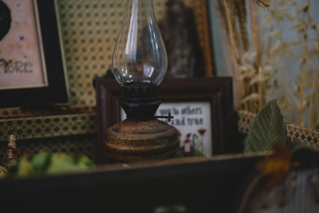 View of a showcase full of interesting old things for sale. Various vintage objects at a indoor flea market. Details of still life in the home vintage interior. Warm cosy autumn concept. Toned image.