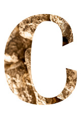 letter C made of shiny golden stones isolated on white