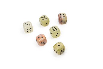 Dices made of natural stone on a white background. Copy space. Gaming.