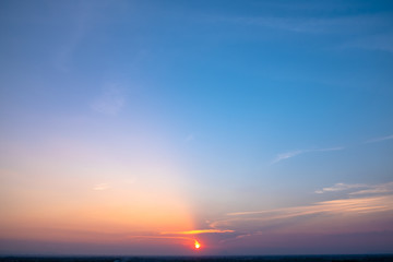Bright orange sky and light of the sun.
