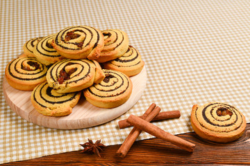 Fototapeta premium Home made baked cookies with raisins and poppy seeds. Space for text or design.
