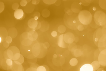 Fototapeta premium abstract soft bokeh light effect with golden background