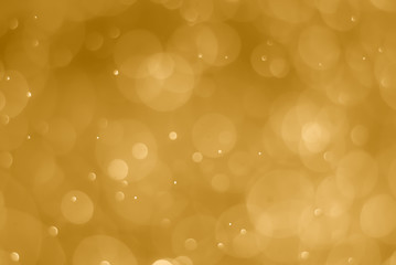 abstract soft bokeh light effect with golden background