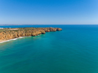 Aerial Scenic seascape, of Ponta da Piedade promontory (cliff formations along coastline of Lagos city), natural landmark destination, Algarve. South Portugal.