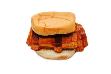 Boneless Pork Sandwich on a Roll Isolated Over a White Background