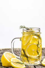 Trendy detox healthy drink. Detox water in bottle with lemon on a wooden table. Summer drink, lemonade. Diet. Copy space