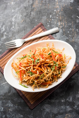 Chinese Bhel is a spicy indo-chinese recipe, served in a bowl. selective focus