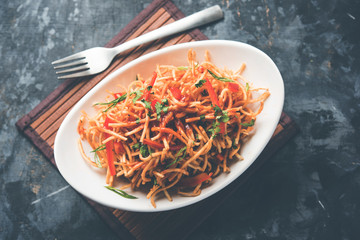 Chinese Bhel is a spicy indo-chinese recipe, served in a bowl. selective focus
