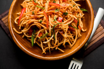 Chinese Bhel is a spicy indo-chinese recipe, served in a bowl. selective focus