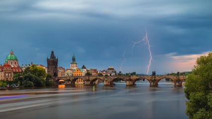 Summer storm over Charles bridge with lightning, Prague, Czech Republic.