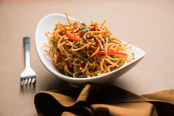 Chinese Bhel is a spicy indo-chinese recipe, served in a bowl. selective focus