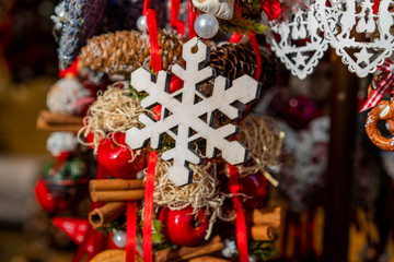 Typical shop selling souvenirs on traditional Christmas Market in historic center of Munich, Germany. Colorful Christmas background. Many different handmade souvenir. Selective focus.