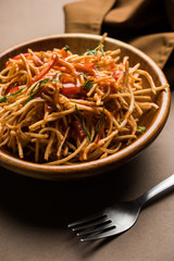 Chinese Bhel is a spicy indo-chinese recipe, served in a bowl. selective focus