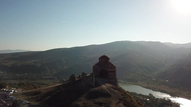 Moody, contrasty aerial shot of the Jvari monastery on a top of a mountain