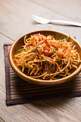 Chinese Bhel is a spicy indo-chinese recipe, served in a bowl. selective focus