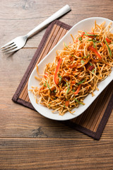 Chinese Bhel is a spicy indo-chinese recipe, served in a bowl. selective focus