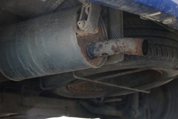 close up of an old rusty exhaust