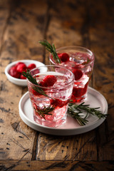 Gin raspberry cocktail with rosemary