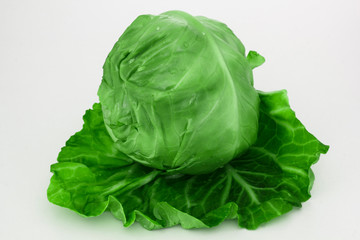 Fresh green cabbage organic vegetable close up on a white background