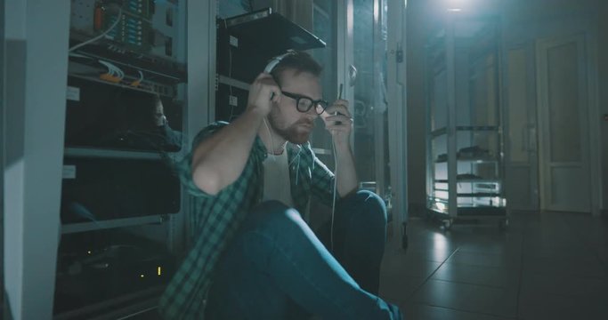 technician relax and listen to music on headphones