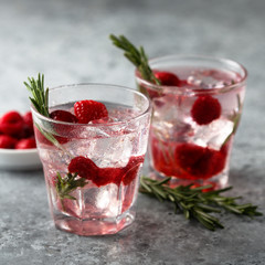 Fototapeta na wymiar Gin raspberry cocktail with rosemary