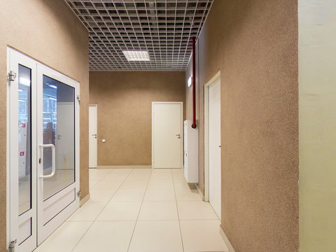 Corridor, brown walls, doors, floor tiles