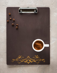 Clipboard copy space and cup coffee Top view. Flat lay style.