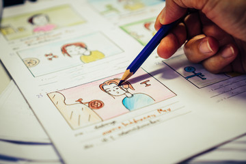 Designer drawing Story board movie video layout for pre-production, development cartoon...