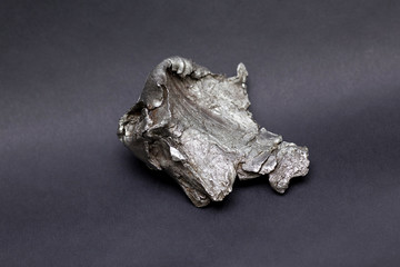 Tektite Meteorite Sikhote Alin isolated on gray background